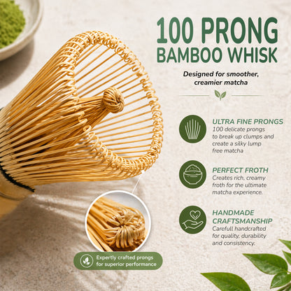 100 prong bamboo whisk with matcha powder and green leaves on a light background