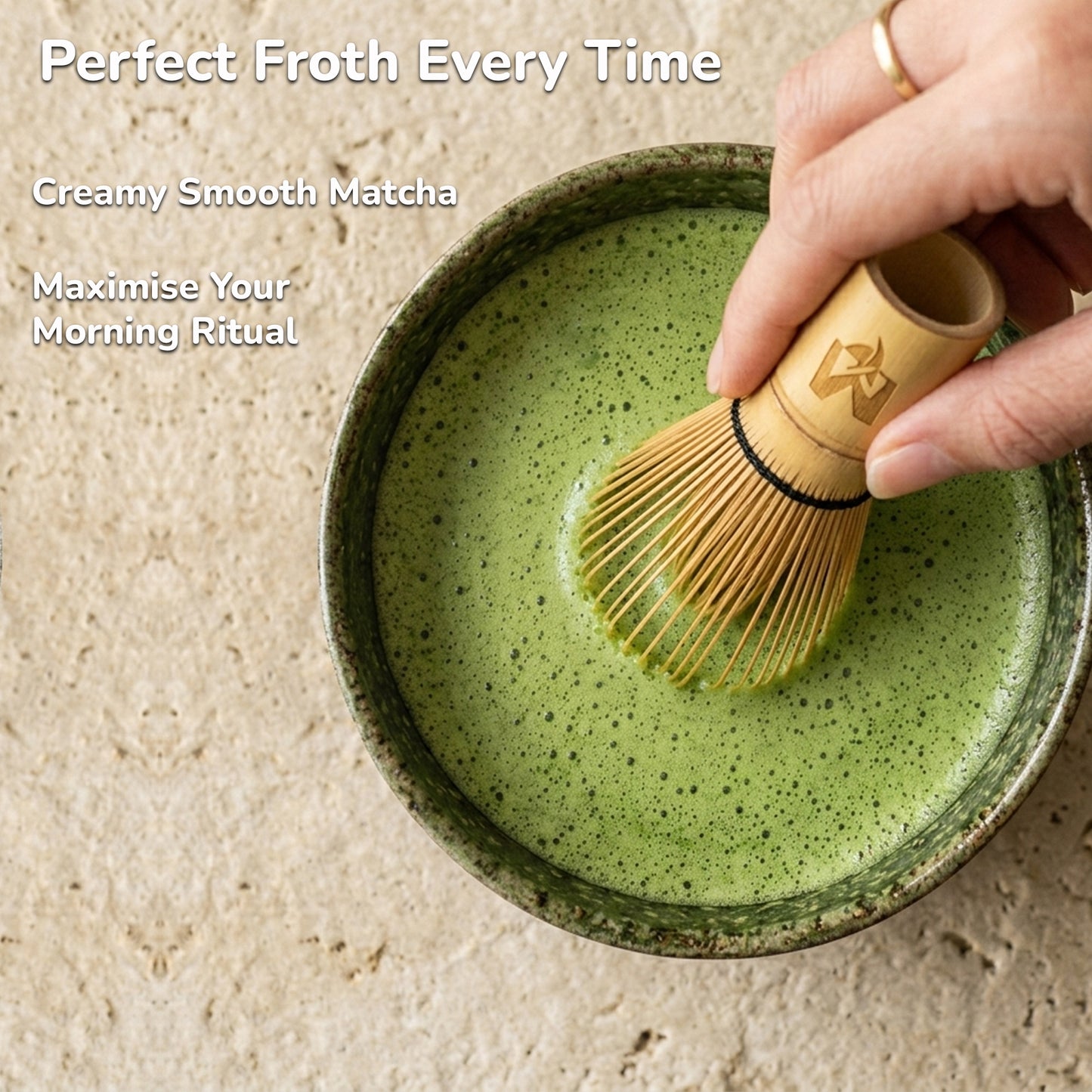 Person using a wooden matcha whisk to froth matcha in a ceramic bowl with text about matcha.