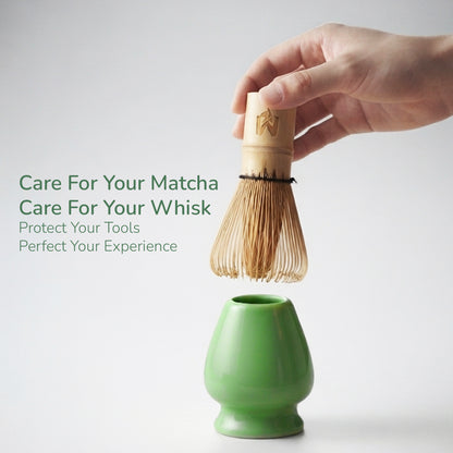 A hand holds a bamboo matcha whisk above a small green ceramic stand against a light gray background, with marketing text on the left.